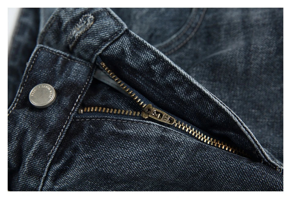 A pair of stylish retro-inspired Japanese jeans in black and grey, featuring a mid-rise waist and straight leg silhouette for a flattering, comfortable fit.