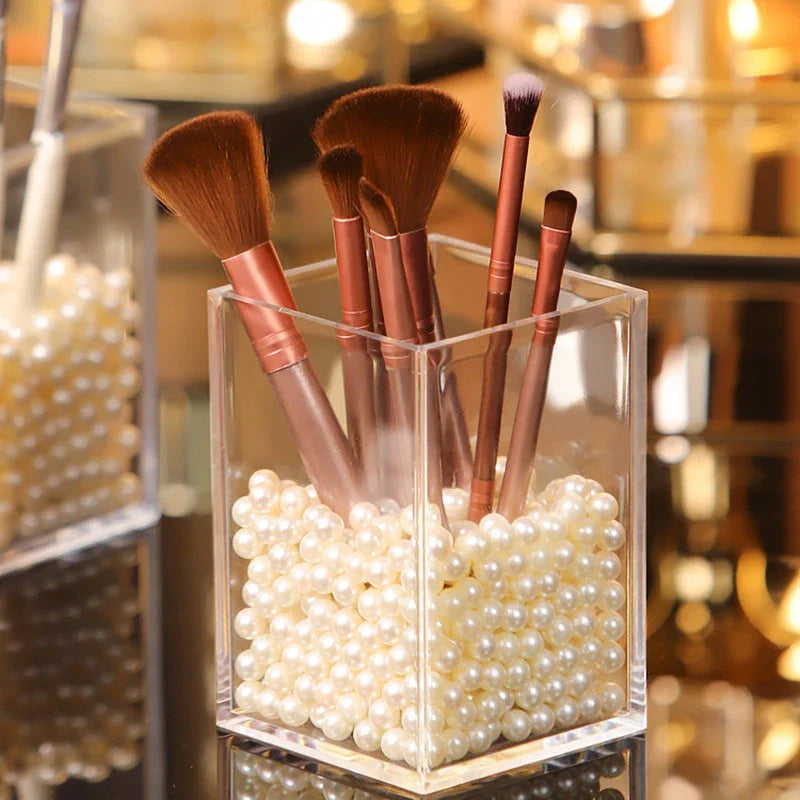 Stylish makeup brush holder with clear acrylic display rack for neatly organising cosmetics and beauty essentials