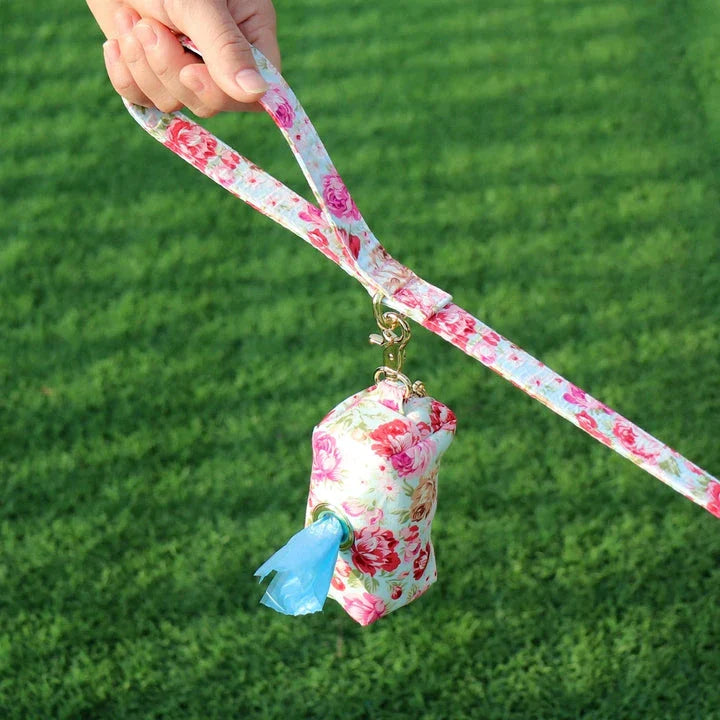 Stylish floral dog walking bag with multiple compartments for treats, snacks, waste bags, and keys