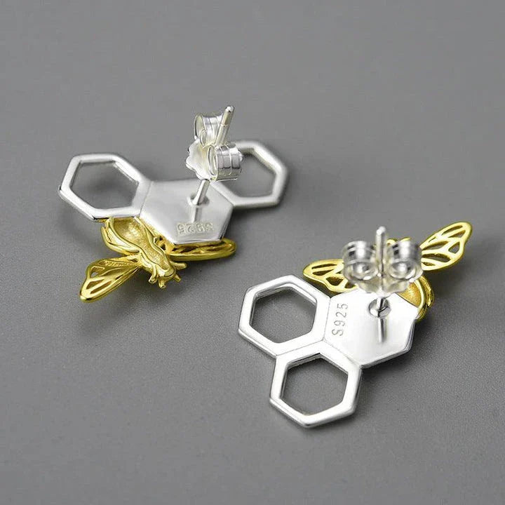Elegant sterling silver beehive-inspired stud earrings with a nature-inspired design, perfect for fashion-conscious women
