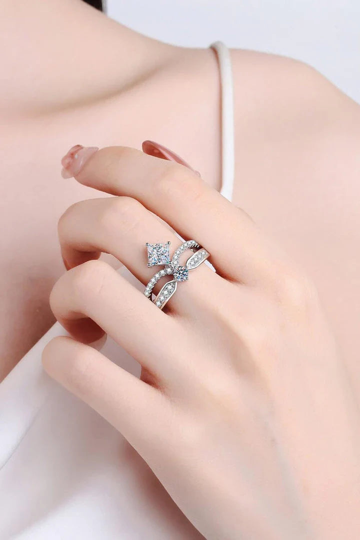 Elegant sterling silver ring with a moissanite centre stone and zircon accents, featuring a modern and minimalist crown design
