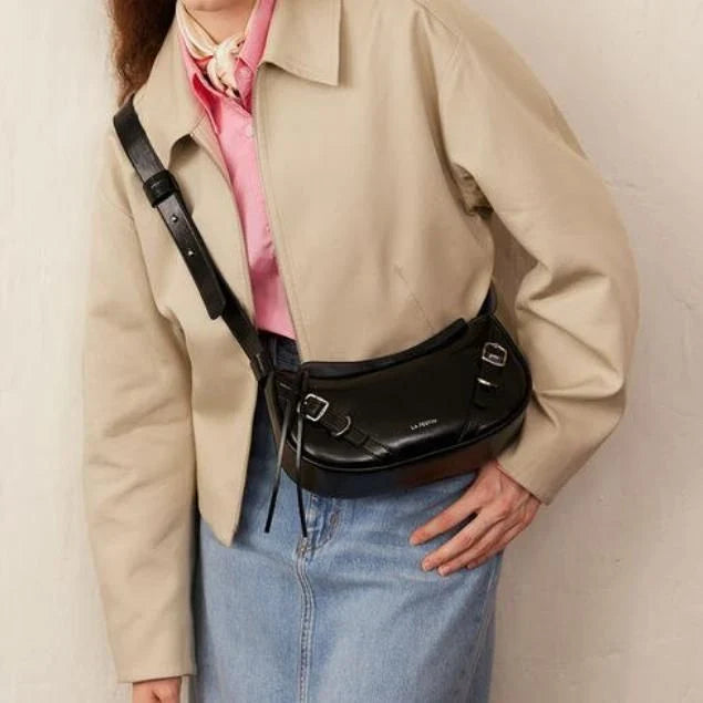 Elegant black shoulder and crossbody baguette bag made with premium split leather and synthetic lining