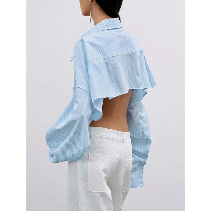 A stylish patchwork blouse with functional pockets, perfect for casual and semi-formal occasions during the autumn and winter seasons.