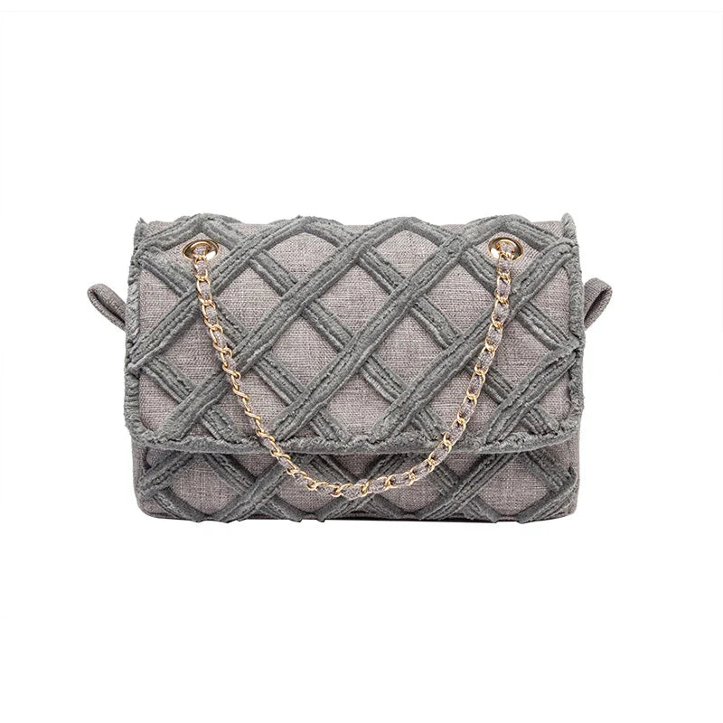 A stylish, retro-inspired shoulder bag with a minimalist rhombus pattern design, perfect for the modern, fashion-conscious woman in the UK.