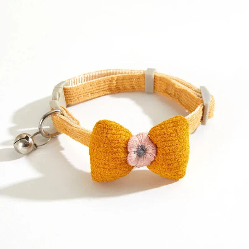 Stylish checkered pet collar with elegant butterfly knot decoration, perfect for dressing up cats and dogs