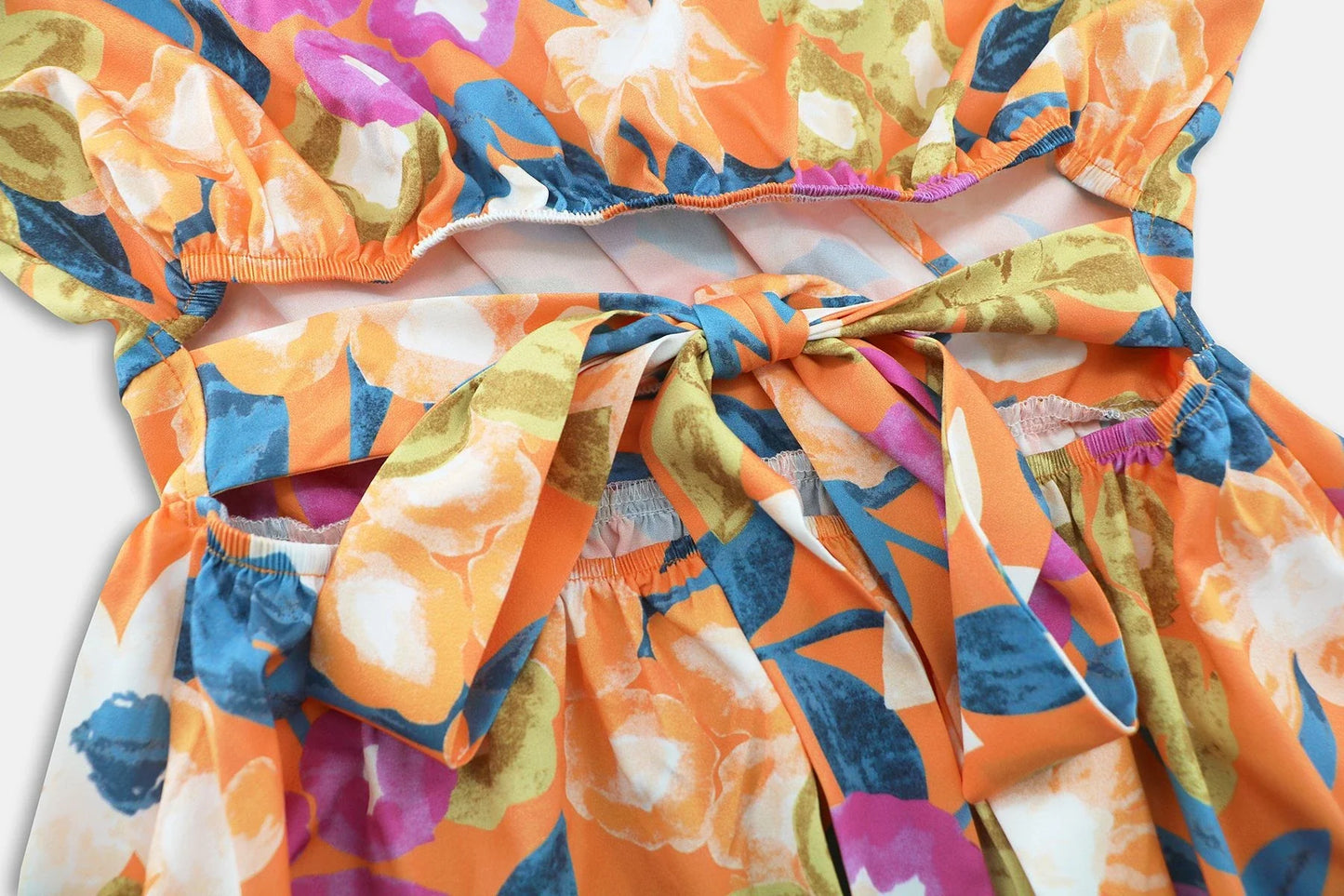 Stylish lantern-sleeve v-neck beach dress in vibrant summer colours, featuring a flattering fit and comfortable stretch fabric