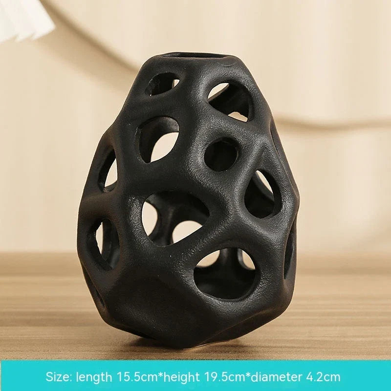 Stylish ceramic decorative balls in geometric design, available in white and black, small and large sizes, for modern home decor