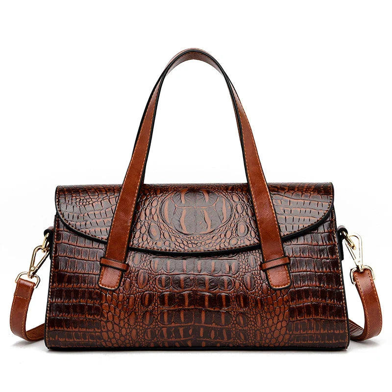 Premium crocodile pattern leather shoulder bag in multiple colours, featuring a pillow-shaped design for comfortable carrying and multiple interior pockets for organisation.