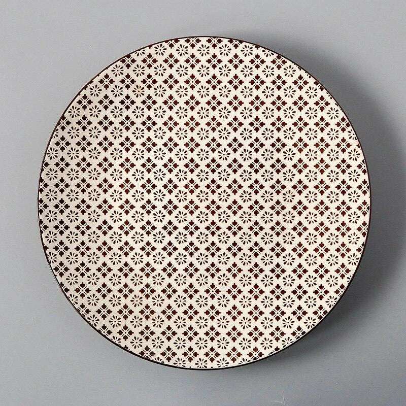 Elegant ceramic plates with vibrant, whimsical prints in a variety of enchanting designs