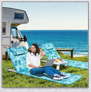 Stylish folding outdoor lounge chair with comfortable padded seat and adjustable backrest, perfect for relaxing by the pool or on the beach