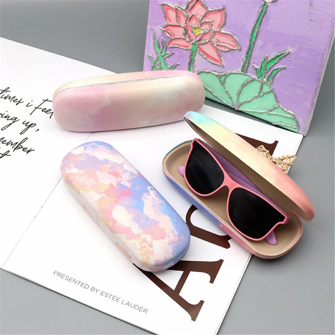 Gradient cloud printed eyewear case with metal frame and PU leather construction, protecting glasses from scratches and everyday wear and tear