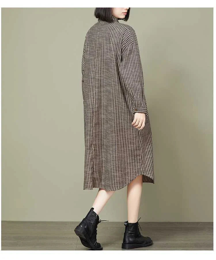 Plus-size women's dress with a striped pattern, asymmetric skirt, and long loose sleeves