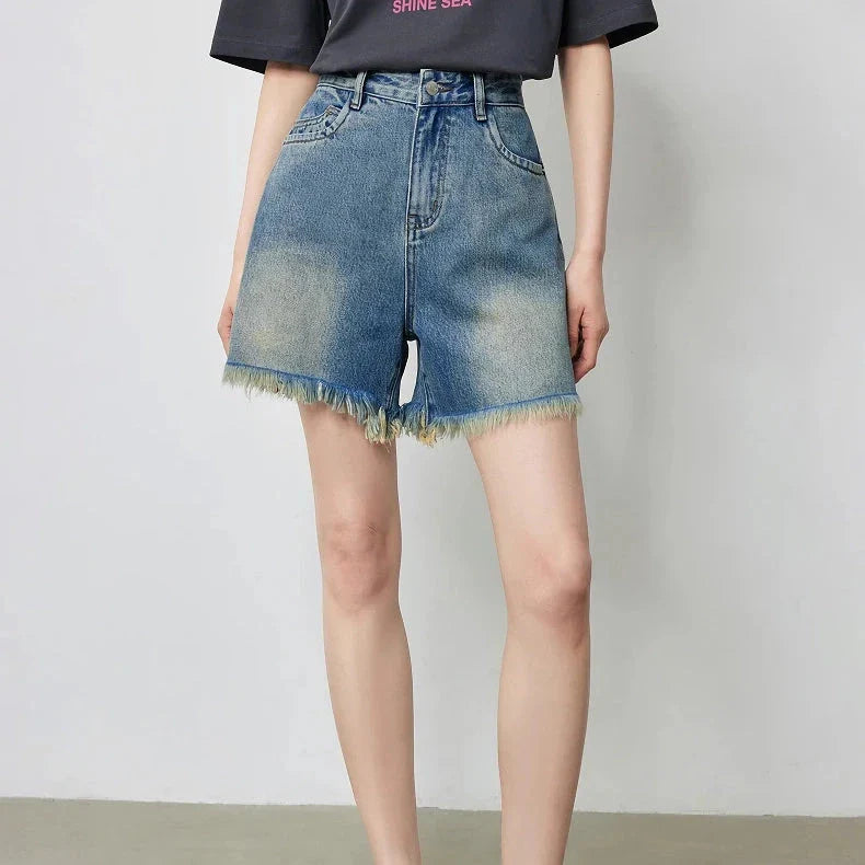 Vintage-inspired high-waisted denim shorts with tassel detailing for women