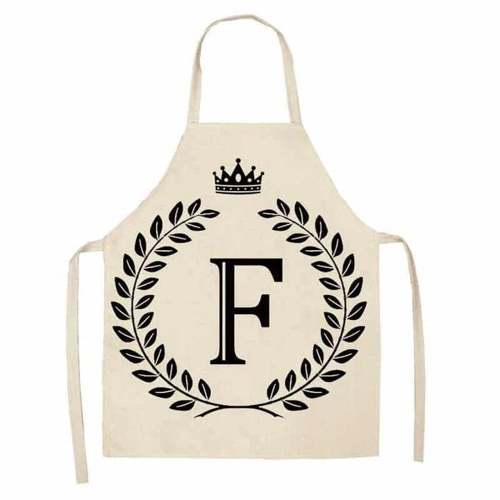A high-quality kitchen apron featuring a charming crown and letter print design in a premium cotton and linen blend fabric.