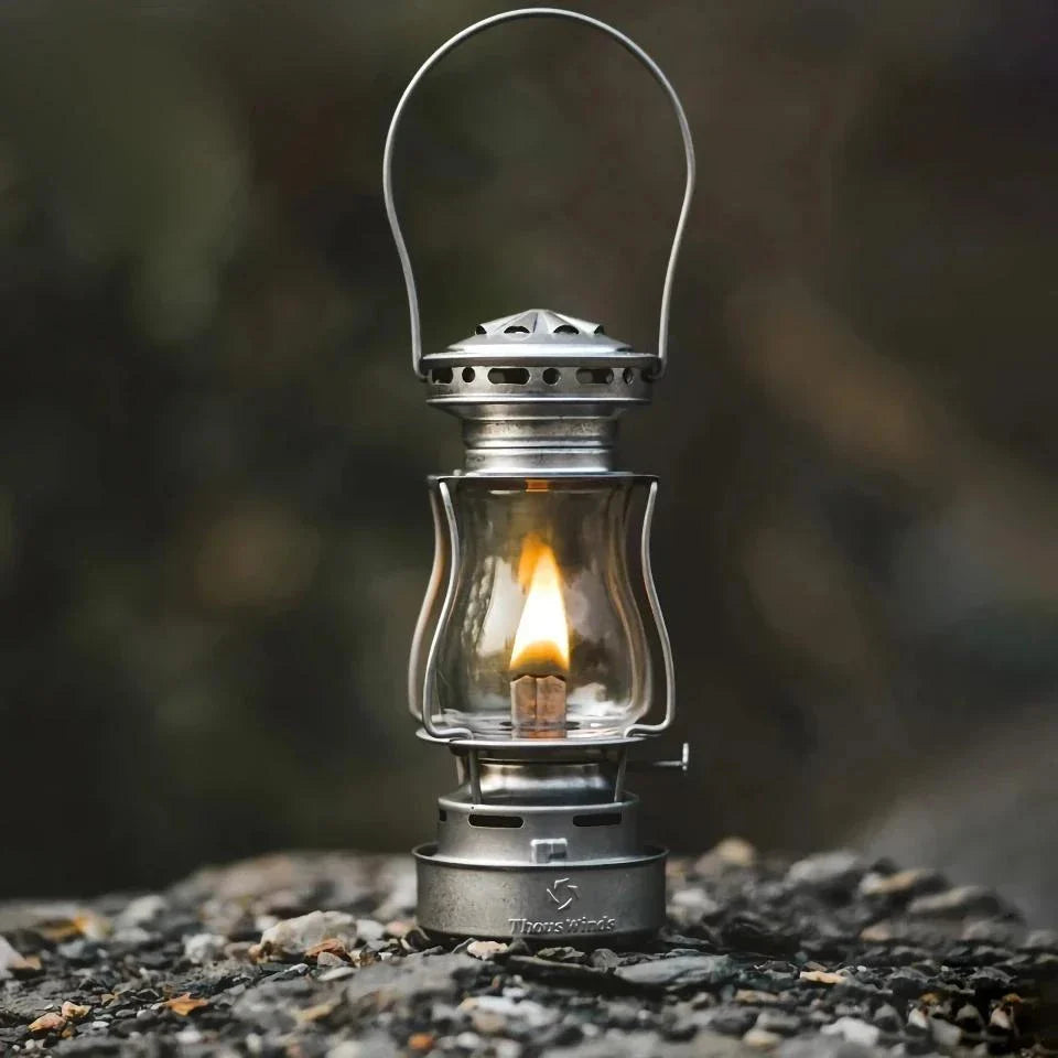 Classic vintage-inspired kerosene camping lamp with stainless steel construction and automatic ignition for reliable outdoor lighting