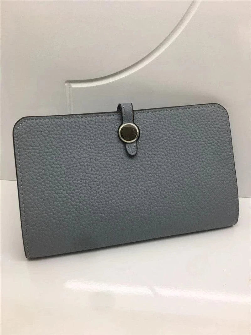 Premium cowhide leather wallet with luxurious lychee pattern design, featuring multiple compartments for secure storage and organisation.