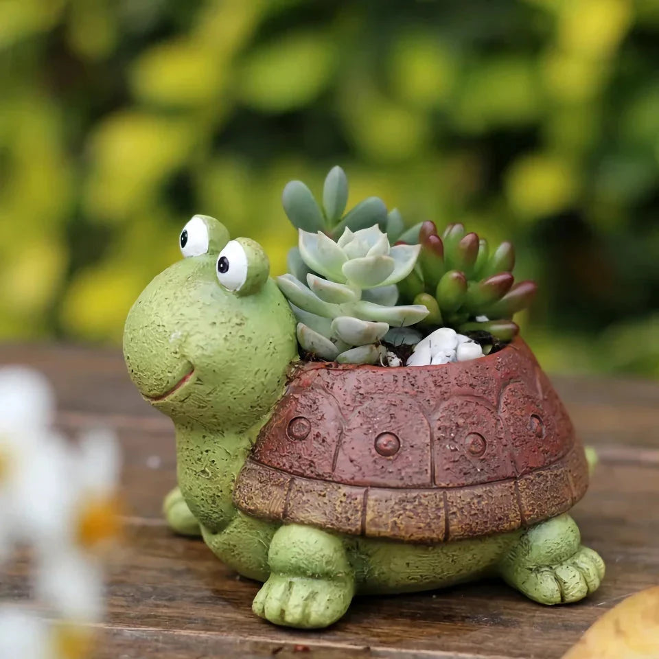 A charming, hand-painted resin planter in the shape of a cartoon turtle, perfect for displaying succulents, cacti, and other small plants.