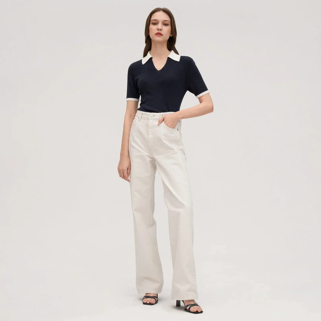 Stylish silk knit polo shirt in navy blue, featuring a slim fit design, contrasting trim, and a feminine v-neckline for refined British elegance.