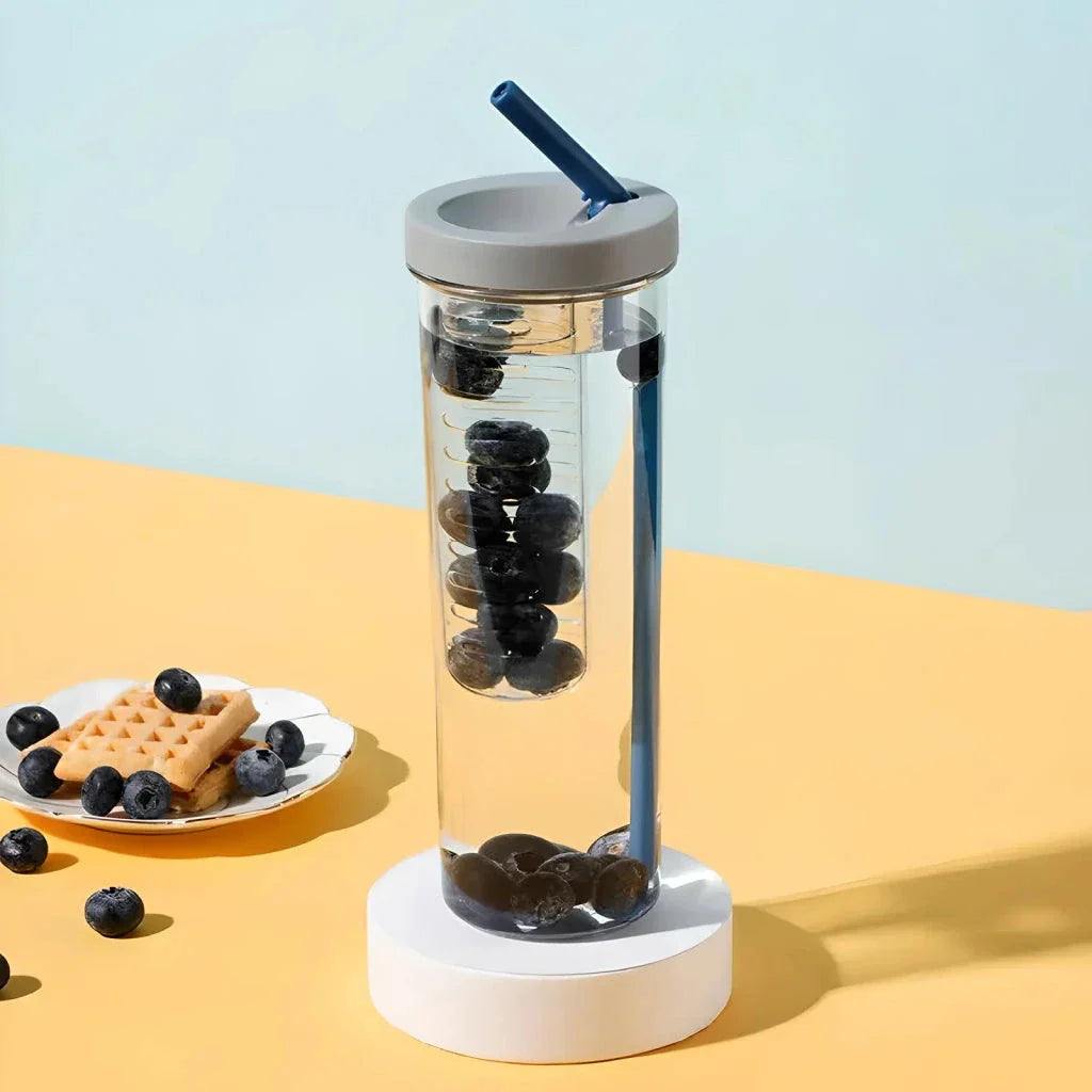 A transparent 700ml drinking bottle with a straw and built-in lemon filter, perfect for staying hydrated on the go.