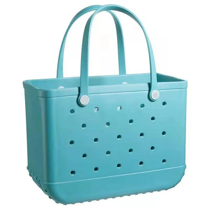 Premium waterproof beach tote bag in various vibrant colours, featuring spacious main compartment and multiple pockets for organised storage
