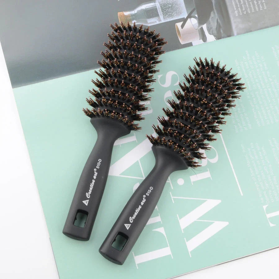 Premium black detangling hair brush with ergonomic long handle for smooth, tangle-free hair and healthy scalp