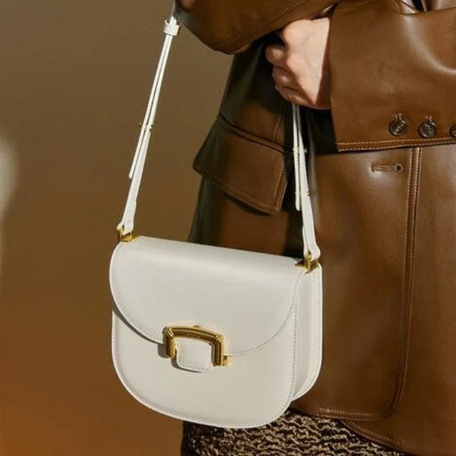 Premium high-end British wedding shoulder bag in brown, with a unique saddle shape design and hardwearing leather exterior