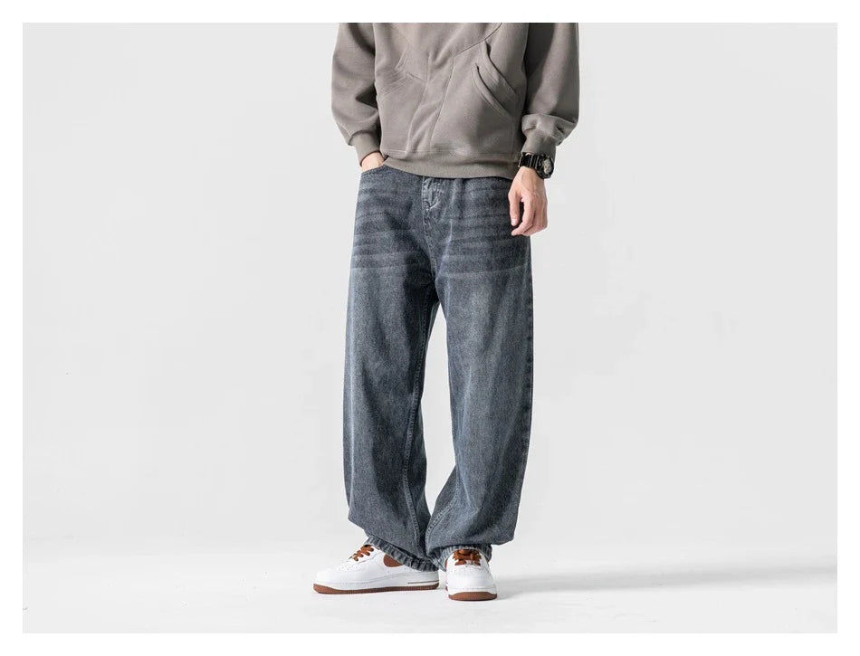 A pair of stylish retro-inspired Japanese jeans in black and grey, featuring a mid-rise waist and straight leg silhouette for a flattering, comfortable fit.