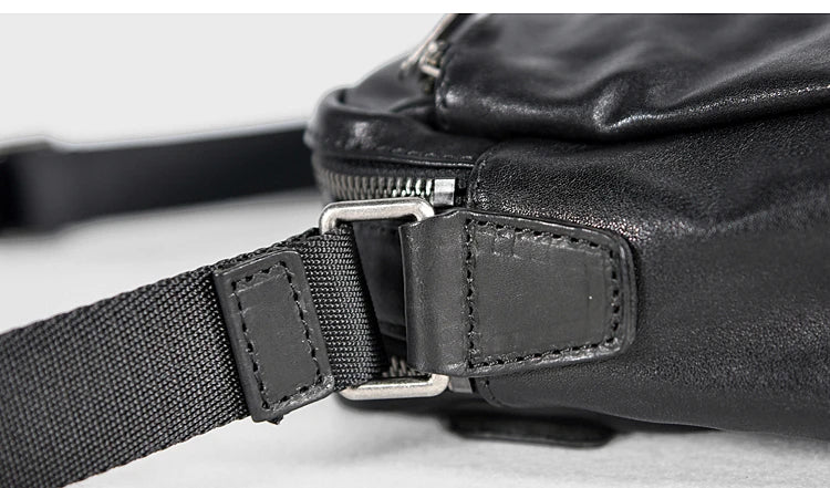 A premium British leather shoulder bag with a sleek, minimalist design and adjustable strap