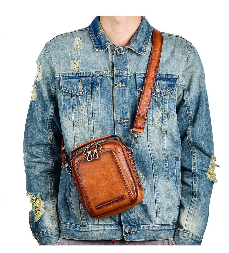 Premium retro leather messenger bag with spacious main compartment, side pockets, and robust handle for comfortable carrying
