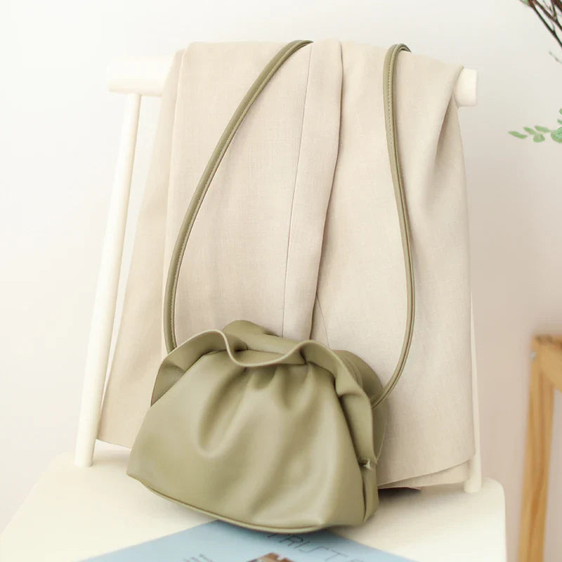 Stylish retro dumpling bag in premium PU material with one-shoulder design and adjustable strap, available in classic British colours