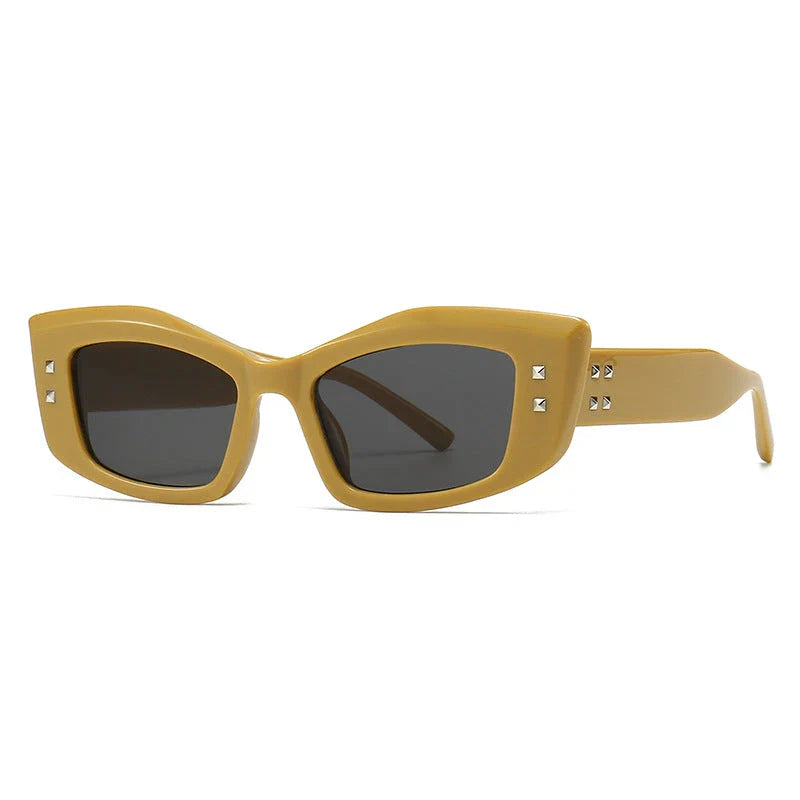 Retro cat eye sunglasses with rivet details, offering a stylish and protective eyewear solution.