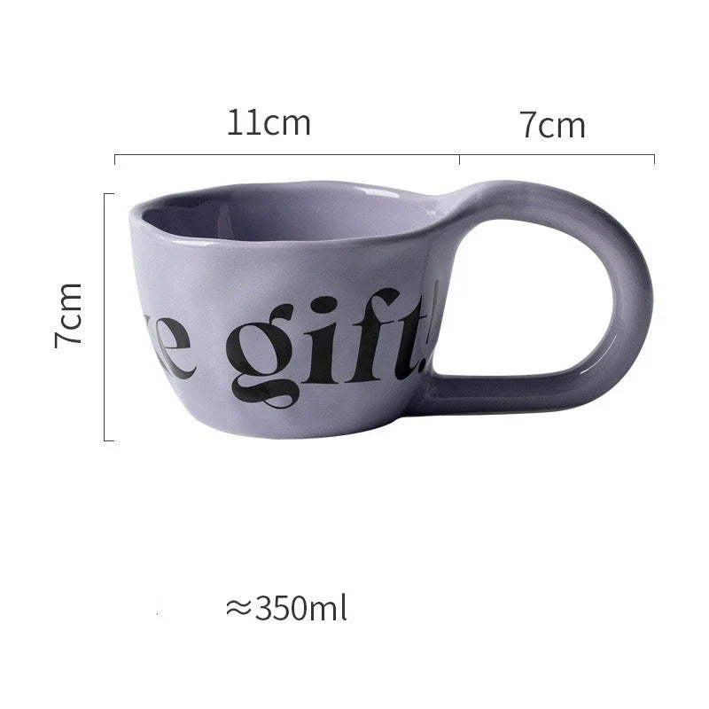 Handcrafted creative alphabet ceramic mug in beige, purple, and khaki colours for hot drinks like coffee and tea