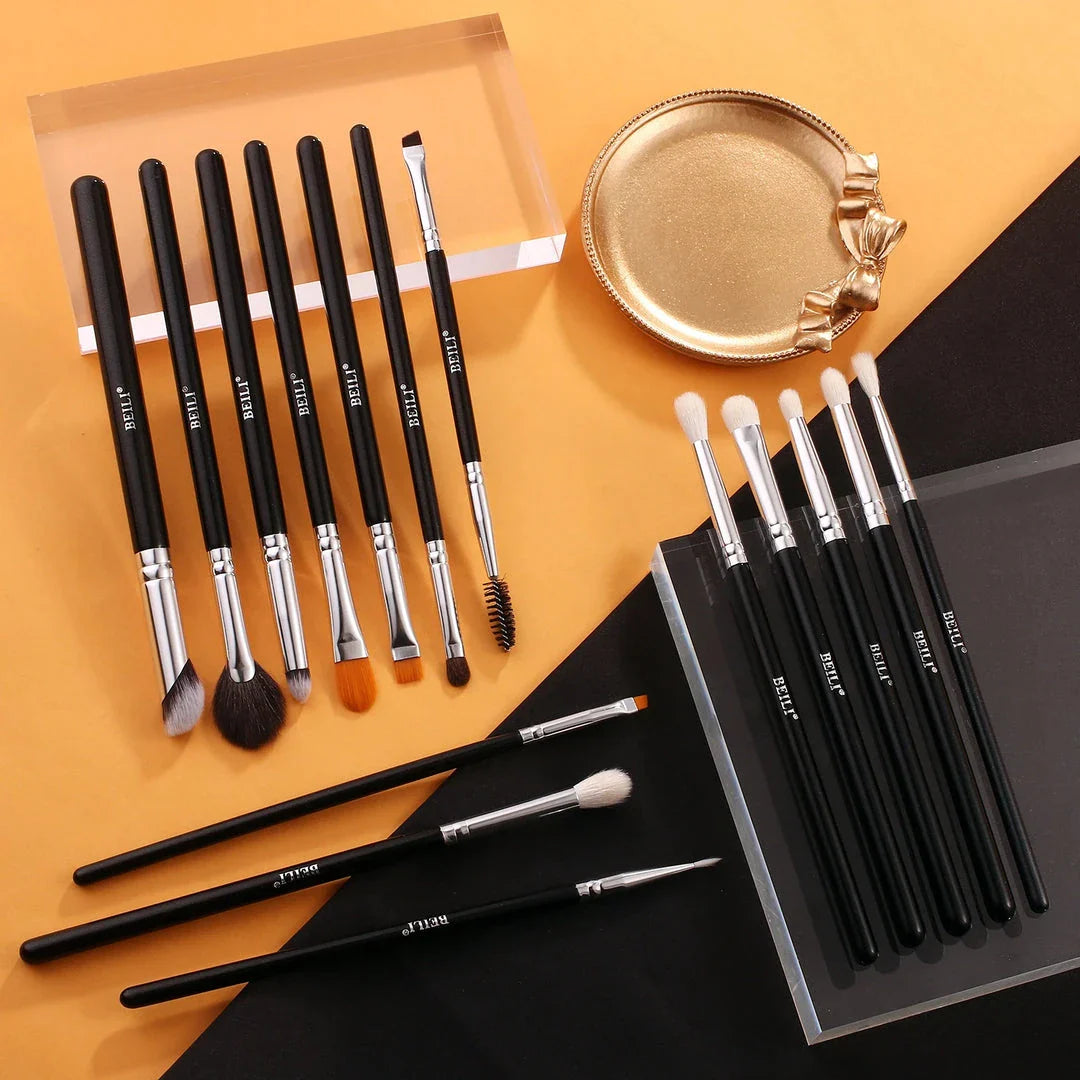 Set of 15 professional eye makeup brushes in a sleek black design, including brushes for brows, lashes, eyeliner, and eyeshadow blending.