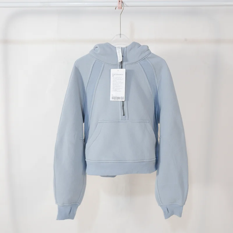 Premium women's sports fleece hoodie with half zip, available in a range of sophisticated colours