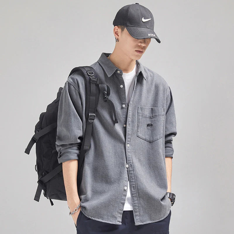 A relaxed, loose-fitting men's shirt in a retro-inspired design, crafted from premium cotton for exceptional comfort and style.