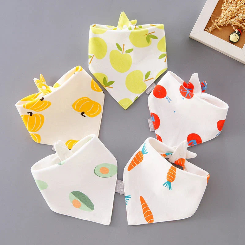 Stylish cotton baby bandana bibs in various fashionable prints, designed to keep your little one dry and comfortable.