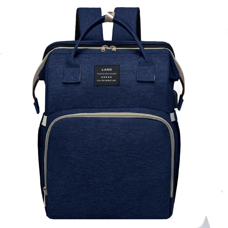 Multifunctional maternity diaper backpack with removable mosquito net, foldable crib, and water-resistant design for convenient family travel