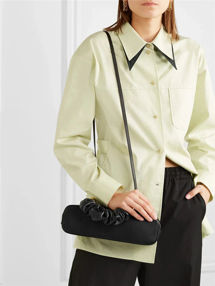 Sophisticated long shoulder diagonal bag with a sleek horizontal square design, made of durable synthetic leather and featuring a single shoulder strap for hands-free convenience.