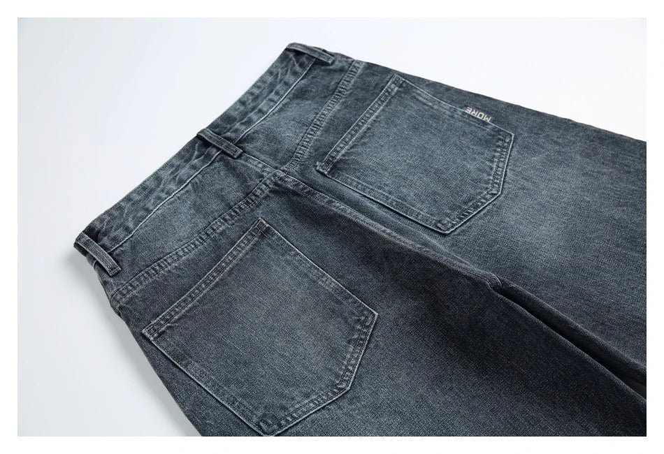A pair of stylish retro-inspired Japanese jeans in black and grey, featuring a mid-rise waist and straight leg silhouette for a flattering, comfortable fit.