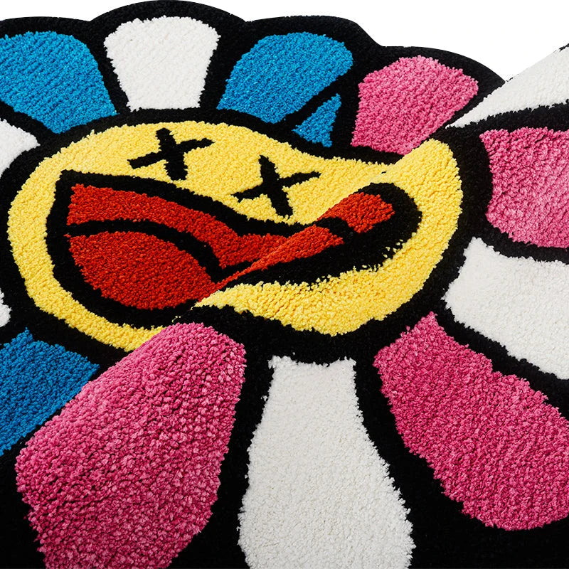 Cheerful smiling face tufted carpet in pink and blue colours, a plush and comfortable home decor item