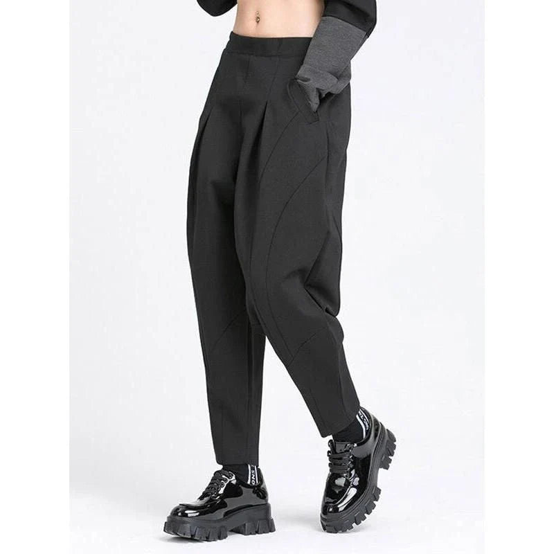Stylish high elastic waist black harem trousers with a split joint design, offering a comfortable and fashionable look