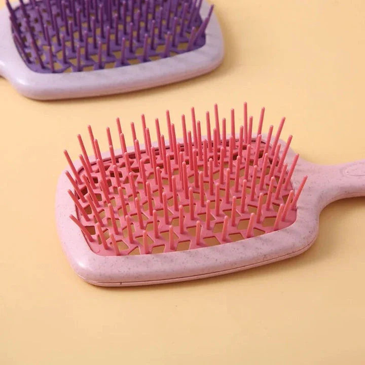 DetanglePro Air Cushion Hair Comb in vibrant colours, designed to effortlessly detangle and smooth all hair types