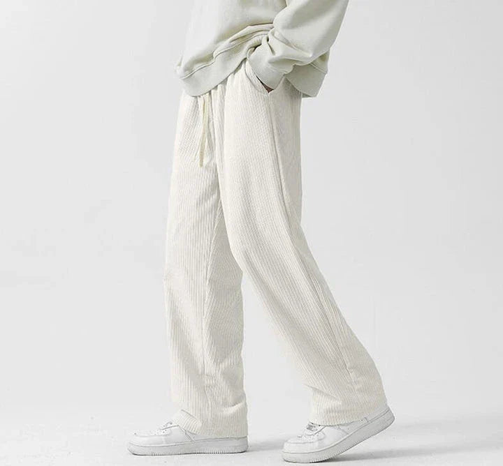 Premium fleece-lined corduroy trousers in a range of versatile colours, featuring a relaxed, straight-leg silhouette for a sophisticated, comfortable look.