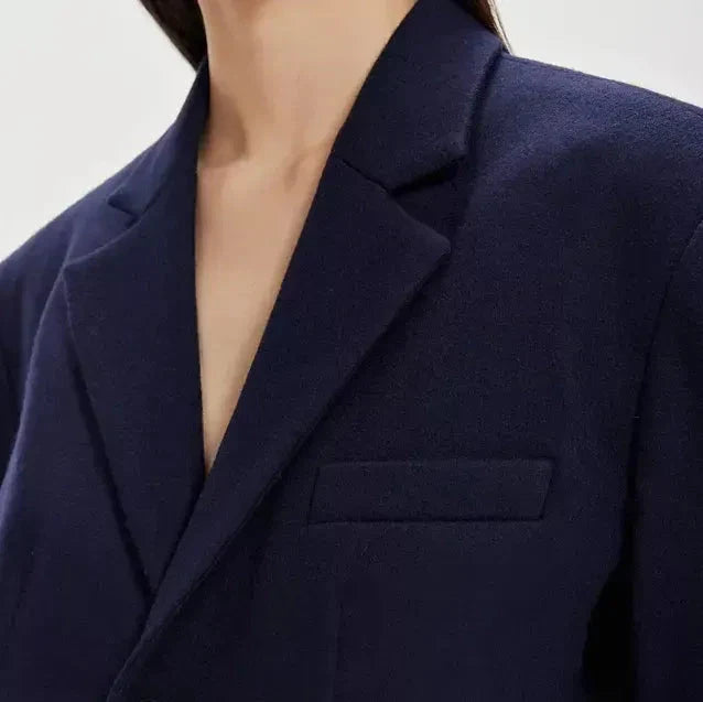 A stylish patchwork denim trench coat with a classic silhouette and a modern edge, perfect for the autumn and winter seasons.