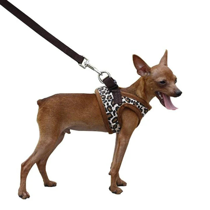 A stylish leopard-print dog harness made of durable polyester material for fashionable pups