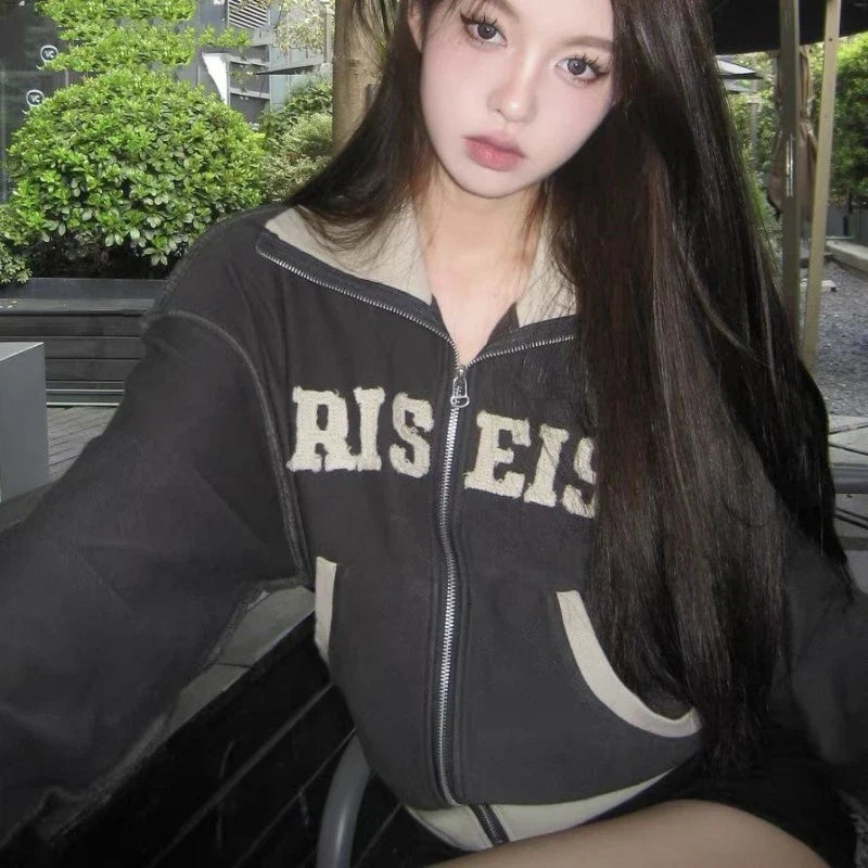 A premium retro-inspired women's sweater jacket made of high-quality polyester with a loose, comfortable fit and a timeless design.
