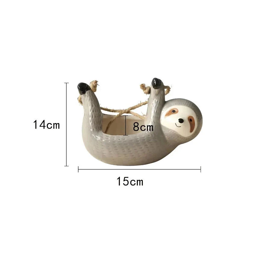 Ceramic hanging planter with a whimsical cartoon animal design, available in grey or yellow, for adding a touch of nature and playfulness to indoor spaces.