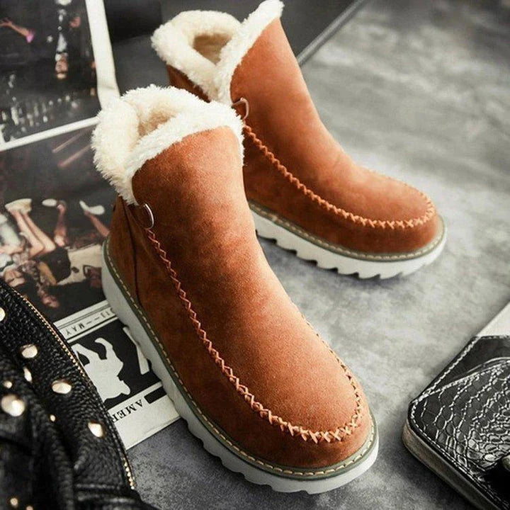 A pair of stylish, non-slip snow boots with a warm artificial wool lining, perfect for British winter weather