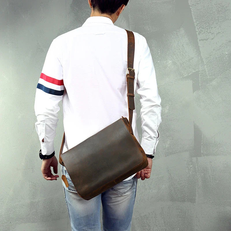A retro-inspired leather shoulder bag for men, featuring a classic British design and high-quality construction