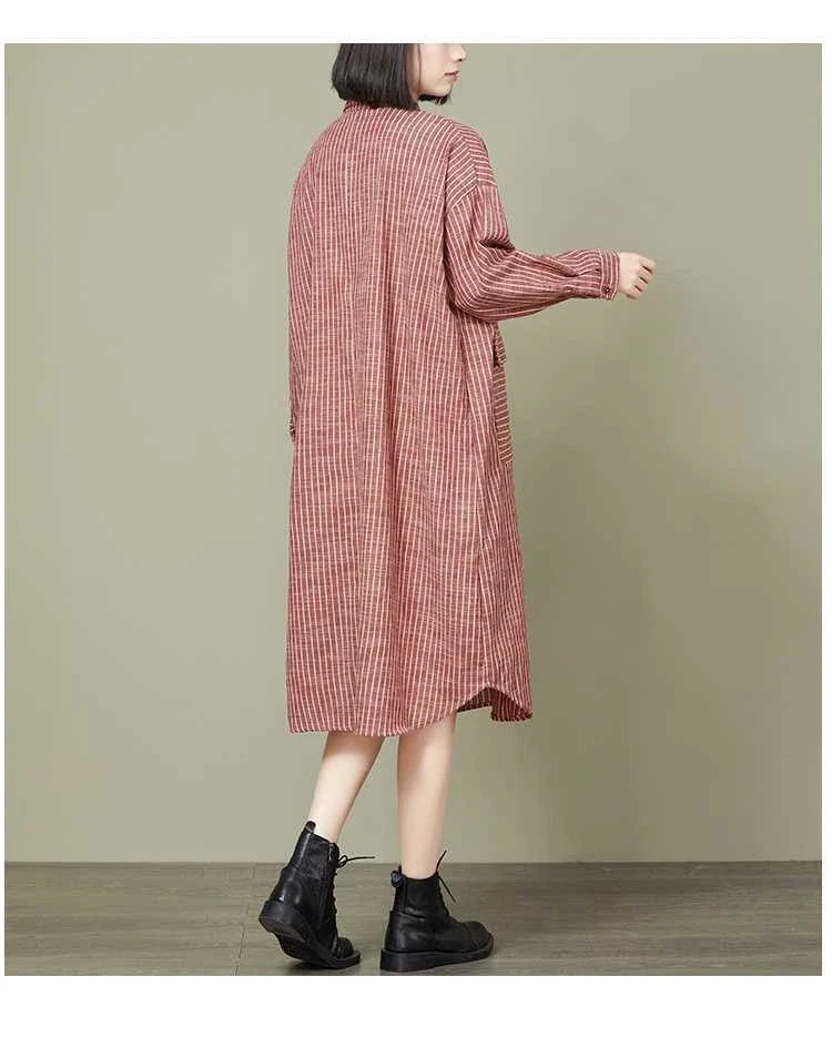 Plus-size women's dress with a striped pattern, asymmetric skirt, and long loose sleeves